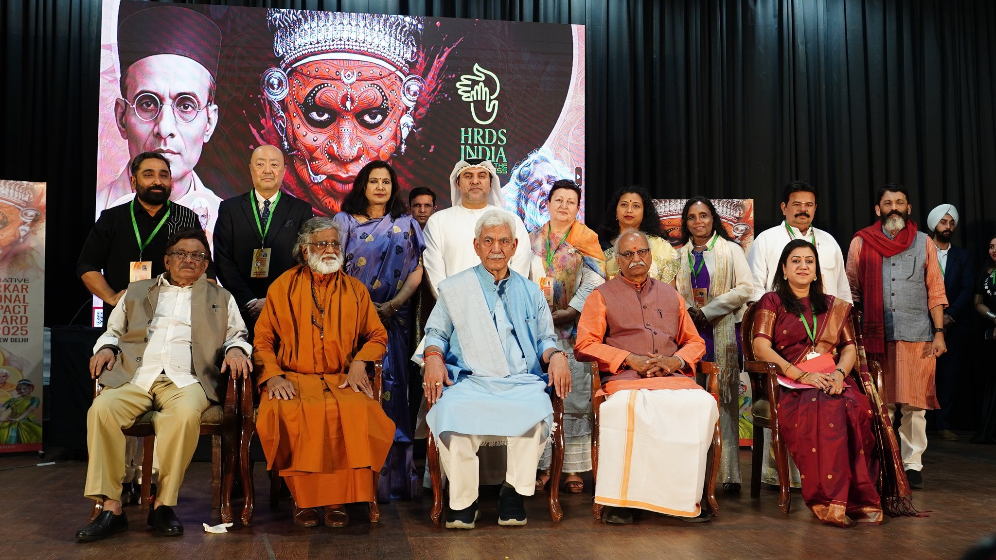 Group photograph of dignitaries at the Veer Savarkar International Impact Award 2025