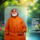 Guru AtmaNambi in orange robes meditating with a quote about being free from mental noise and the yoga of listening.