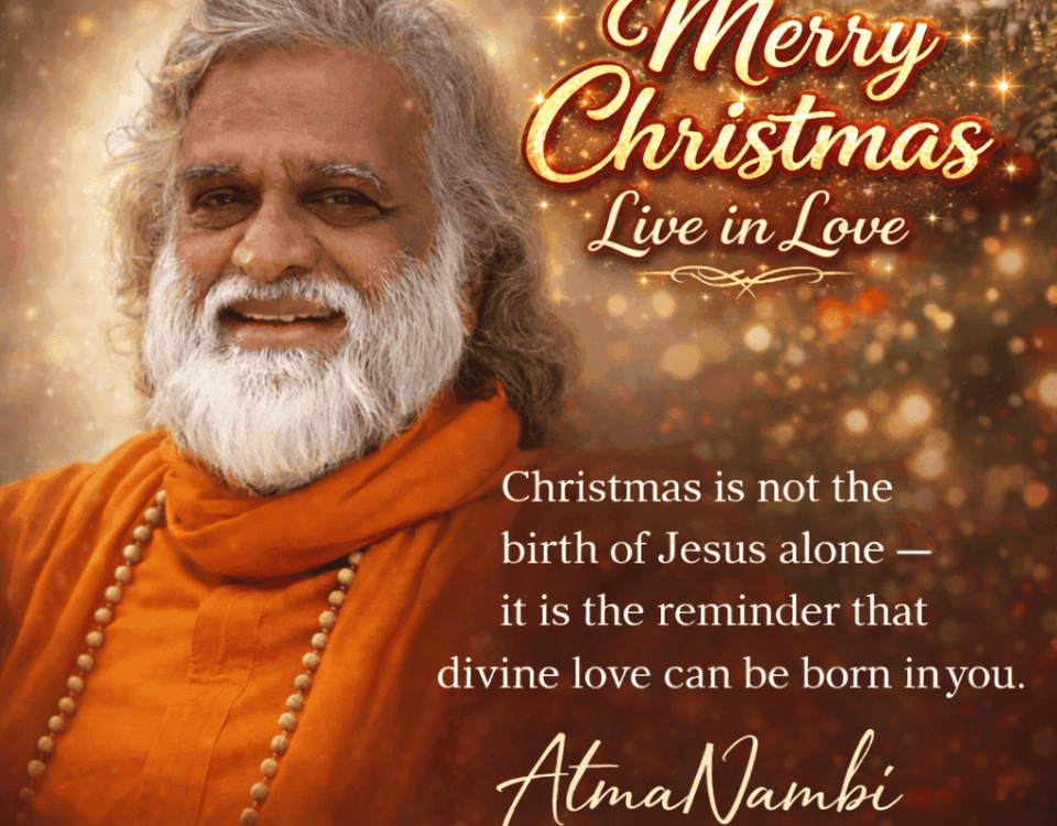 Guru AtmaNambi smiling in orange robes with a Christmas quote about divine love and spiritual awakening.