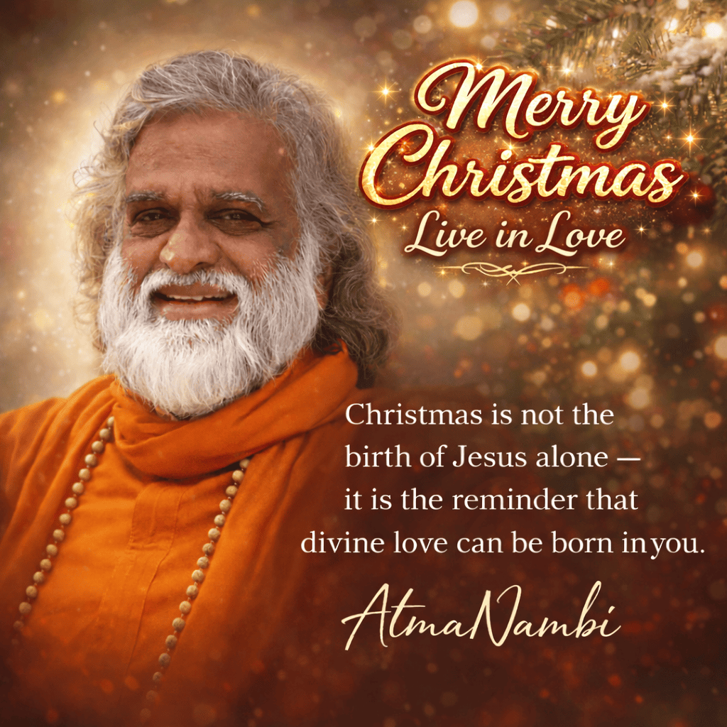Guru AtmaNambi smiling in orange robes with a Christmas quote about divine love and spiritual awakening.