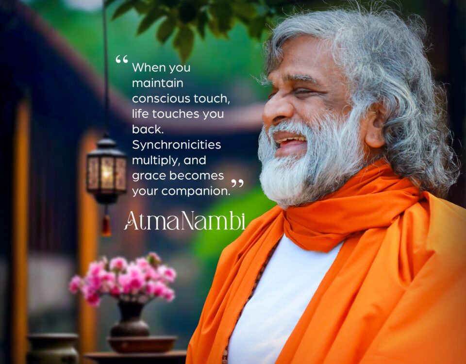 Portrait of Guru AtmaNambi smiling with a quote about the power of conscious touch and synchronicity and the flow of grace.