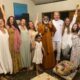 Guru AtmaNambi smiling during the Mass Awakening Brazil spiritual journey, surrounded by devotees at a satsang.