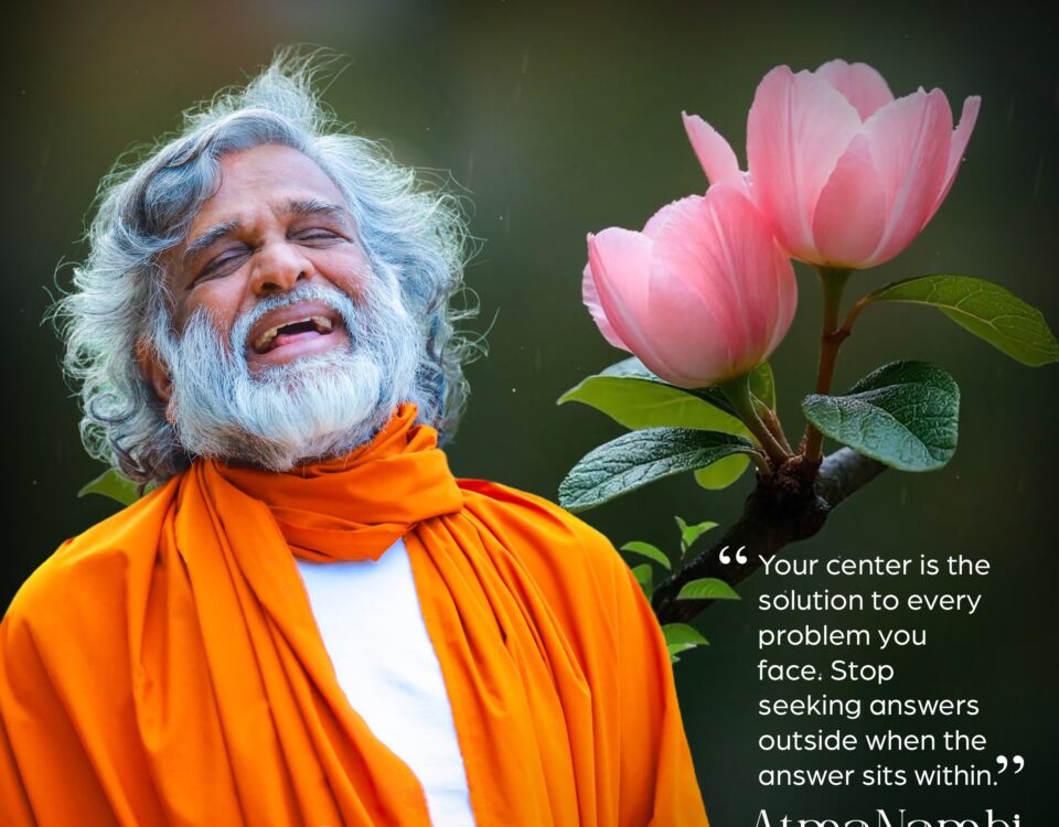 AtmaNambi spiritual master with pink lotus flowers teaching that your center is the solution and inner peace comes from seeking answers within.