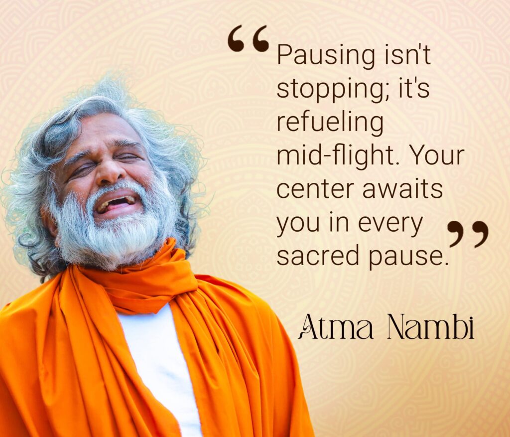 AtmaNambi spiritual master in orange robes teaching about sacred pause meditation and returning to your spiritual center for inner refueling.