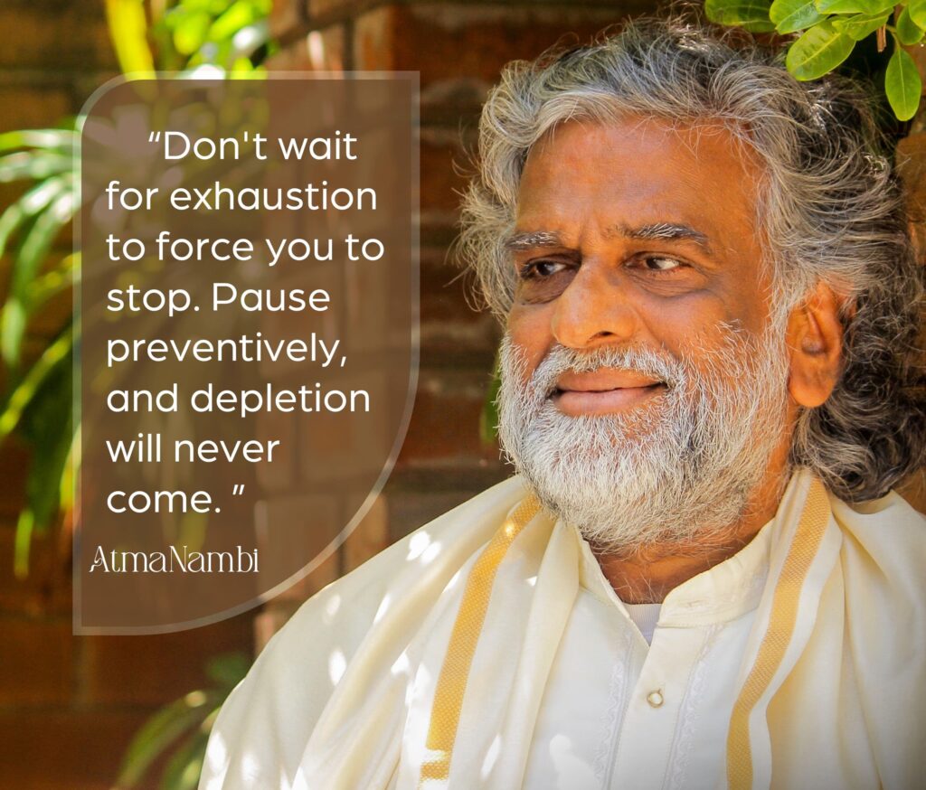 AtmaNambi spiritual master in white robes teaching about preventing burnout spiritually by pausing preventively before exhaustion and depletion occur.