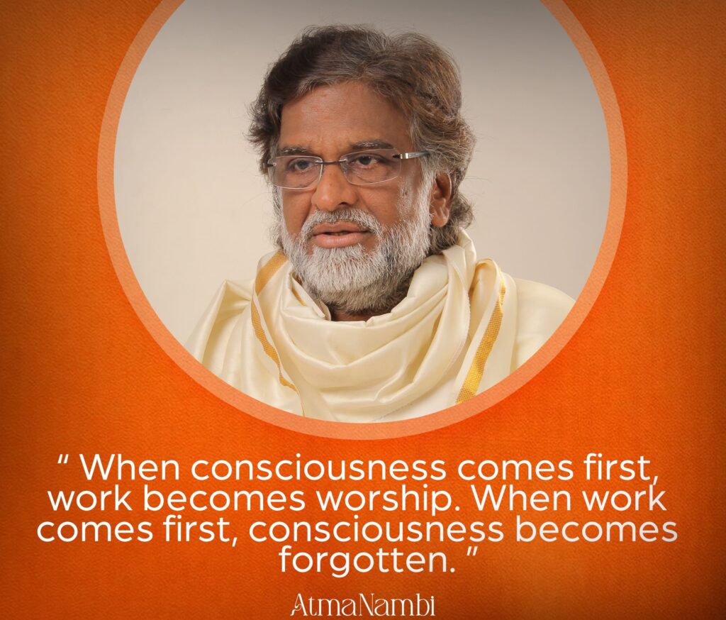 AtmaNambi spiritual master in white robes teaching about conscious work practice where consciousness comes first and work becomes worship.
