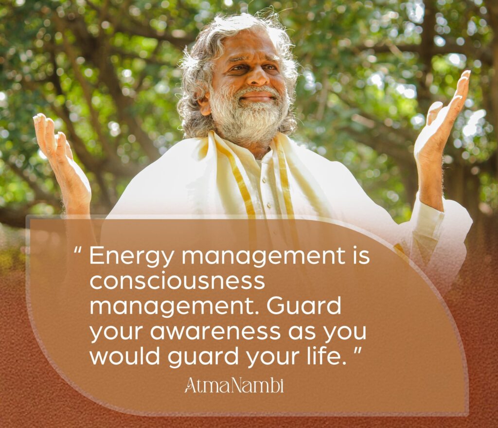AtmaNambi spiritual poster with quote on energy management as consciousness management, urging seekers to guard their awareness as they would guard their life.