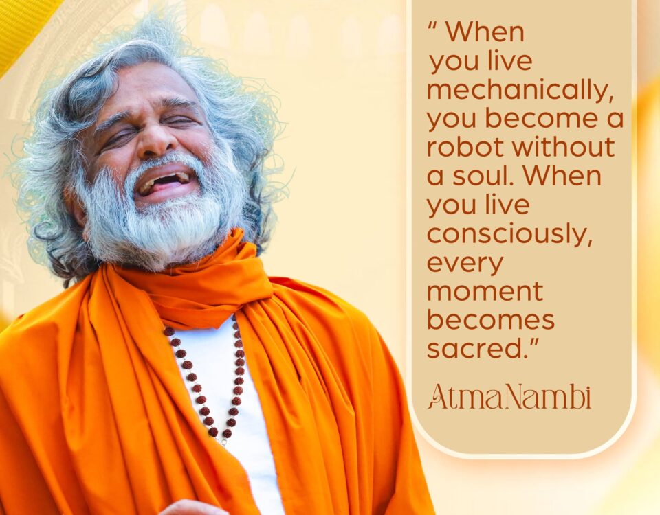 AtmaNambi spiritual quote poster in saffron robes with rudraksha beads, teaching that mechanical living makes you a robot without a soul while conscious living makes every moment sacred, featuring AtmaNambi in ecstatic open-hearted expression.
