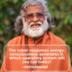 AtmaNambi spiritual quote poster featuring the enlightened Indian master in orange robes and glasses outdoors, delivering his powerful teaching that consciousness generates energy while robotic unconscious living consumes it, asking which operating system you will run today.