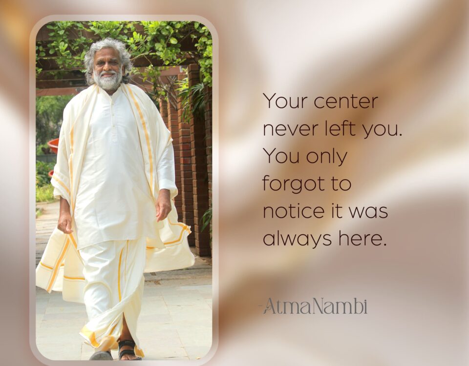 AtmaNambi spiritual poster with quote on your center never having left, featuring the enlightened master walking serenely in white and gold robes through a sunlit garden courtyard.