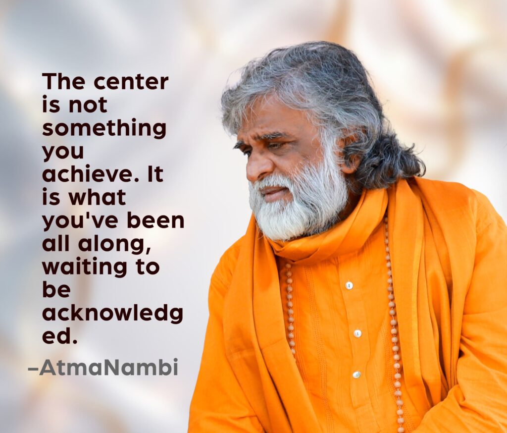 AtmaNambi, Indian spiritual master in saffron robes with eyes cast gently downward, beside a spiritual quote on inner being — the center is not achieved but recognized.