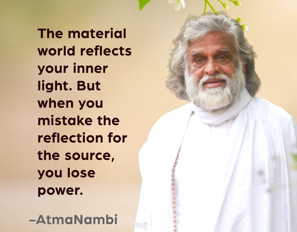 AtmaNambi, Indian spiritual master in white robes with rudraksha mala, beside a spiritual quote on inner light — the material world reflects your light, but mistaking the reflection for the source causes loss of power.