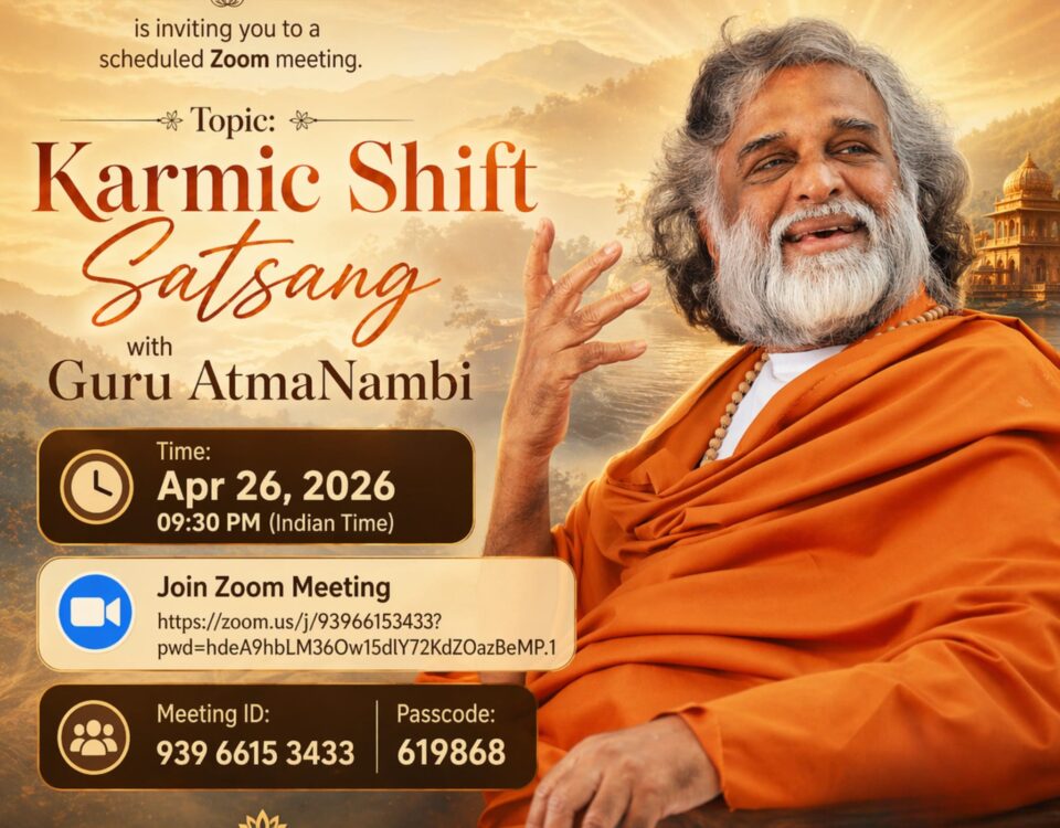 Guru AtmaNambi in saffron robes warmly gesturing, inviting global seekers to join the Karmic Shift Satsang live Zoom meeting hosted by UAM Ashram on April 26, 2026.